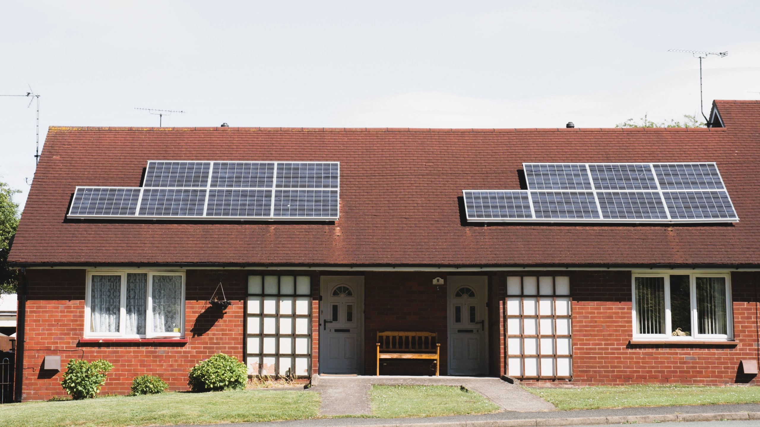 Energy efficient house with solar panels on the roof